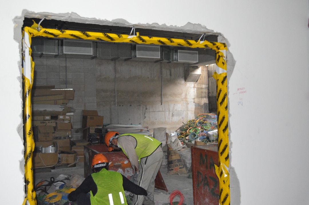 worker installing door